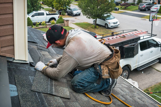 Professional Storm Damage Roof Repair technician working in Saint James City, FL